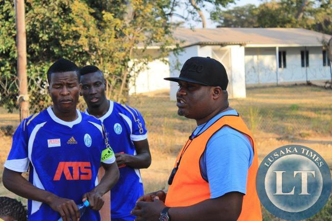Assistant Coach George Chilufya gives a halftime talk to the Radiants