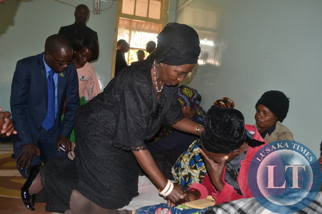 MARY Munthali, mother to late Abel Munthali who is one of the deceased miners, breaks down while being consoled by acting President Inonge Wina