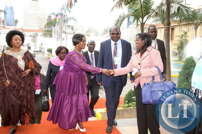 First Lady Esther Lungu greets Ministry of Health's Dr Sharon Kapambwe as Ministry of Health Deputy minister Dr Chitalu Chilufya looks on on arrives at Kenya International Convention Centre for the main Plenary Session of the 9th Stop Cervical , Breasts and Prostrate cancer in Africa Conference in Nairobi on July 21,2015 -Picture by THOMAS NSAMA