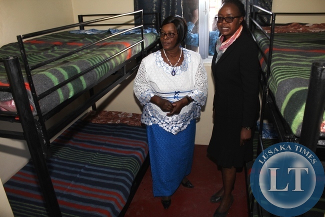 -First Lady Esther Lungu (l) with Lewanika General Hospital Superintendent Dr. Mapani Mutanga (r) inspects the beds in the new Lewanika General Hospital Relatives’ Shelter constructed with the support of the Ministers’ Wives Club in Mongu