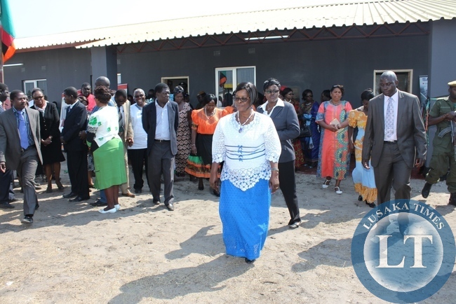 First Lady Esther Lungu (c) leaves the new Lewanika General Hospital Relatives’ Shelter after commissioning it in Mongu