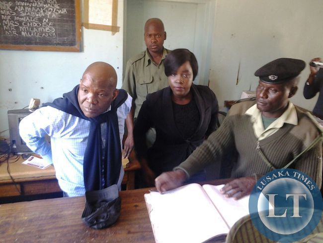 Fred Mmembe with Reporter Mukosha Funga at Woodlands Police Station