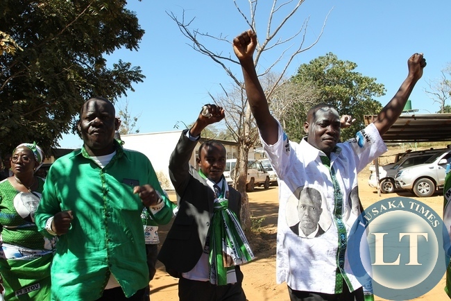 PF candidate Anthony Kasandwe celebrates after successfully filing nominations as aspiring candidate for Bangweulu constituency, in Samfya. Celebrating with him is Home affairs Minister Davis Mwila and Community Development minister EmerineKabanshi.