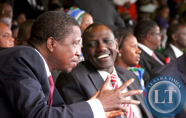 President Lungu talks to Kenya's deputy President William Ruto during Malawi's 51st Independence Celebrations at Kamuzu Stadium in Blantyre on July 6,2015 -Picture by THOMAS NSAMA