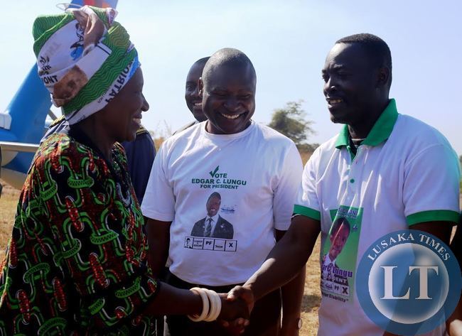 VICE President inonge wina shake hands with PF bangweulu candidate Anthony Kasandwe on arrival in Samfya to drum up support for August 6 by election. Looking on is Fr. Frank Bwalya