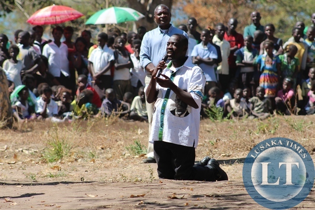 PF Candidate Anthony Kasandwe Kneeling down at Katanshya Primary School asking for votes from the People of Bangweulu constituency on the 6th August Parliamentary by-election in Katanshya Ward