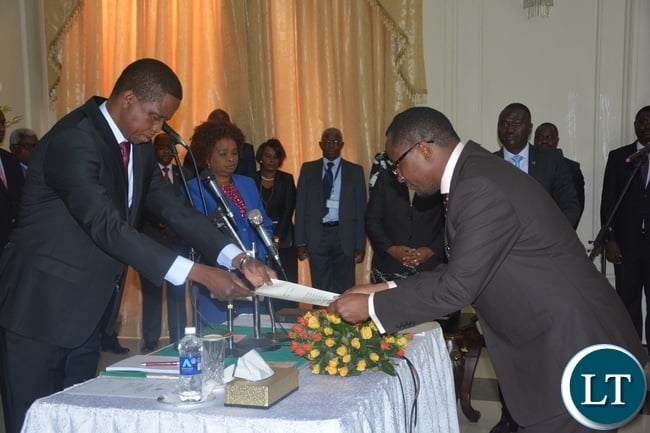 President Edgar Lungu receiving credentials from Newly appointed Defence Minister Richwell Siamunene during the swearing in Ceremony at State House