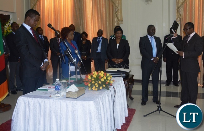 Richwell Siamunene being sworn in as Defence Minister by President Edgar Lungu during the swearing in Ceremony at State House