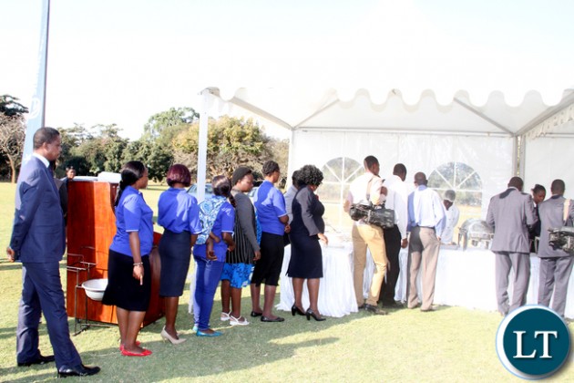 President Edgar Chagwa Lungu join a queue for Lunch during the junior achievers Mentorship Programme at State House on August 10,2015 -Picture by THOMAS NSAMA / STATE HOUSE