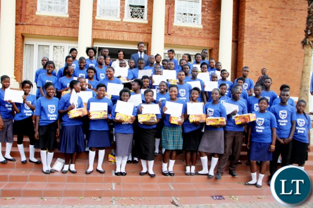 President Lungu and First Lady Esther Lungu and ministers spouses pose for a photograph with Junior achievers during the First Lady's Mentorship Programme of the Junior achievers at State House on August 10,2015 -Picture by THOMAS NSAMA / STATE HOUSE