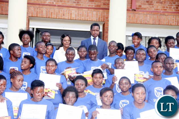 President Lungu and First Lady Esther Lungu pose for a photograph with Junior achievers during the First Lady's Mentorship Programme of the Junior achievers at State House on August 10,2015 -Picture by THOMAS NSAMA / STATE HOUSE