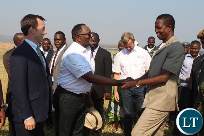 PRESIDENT Edgar Lungu (r) shakes hands with Yalelo Fresh Zambian Fish Company Director Fisho Mwale while Board Chairman Adam Taylor (l) looks on. This was after the official opening of a fish farming company at Kamimbi village in Siavonga district PRESIDENT Edgar Lungu (r) shakes hands with Yalelo Fresh Zambian Fish Company Director Fisho Mwale while Board Chairman Adam Taylor (l) looks on. This was after the official opening of a fish farming company at Kamimbi village in Siavonga district