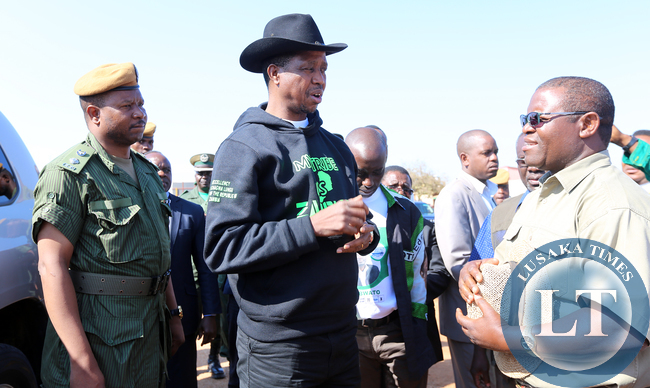 resident Edgar Lungu with Pf Candidate Anthony Kasandwe at Chinsaka Primary School In Kapata Ward East one in Bangweulu By Election . Picture by Eddie Mwanaleza/ Statehouse.03-08-2015.