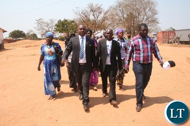 Opposition Movement for Multy- Party Democracy (MMD) Solwezi west parliamentary by- election candidate Fordson Musele (l) with MMD national secretary Rapheal Nakachinda (r ) walking towards the nomination center at Mwajimambwe primary school in Solwezi on Wednesday before the former withdrew his candidature at the last minute in the nomination room to rally behind Patriotic Front (PF) candidate Martin Mbaya. Picture by BETRAM KAOMA /ZANIS
