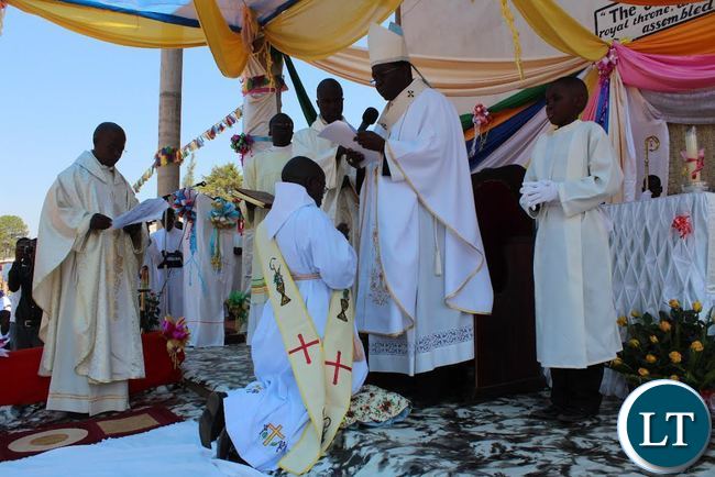 APOSTOLIC administrator of Mpika Diocese His Grace Archbishop Ignatius Chama blessing Brother Deogratius Sikazwe before ordaining him as a Catholic Priest. This was during an ordination ceremony held at Katibunga Parish in Mpika