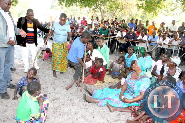 First Lady Esther Lungu (R-sitting) when she visited victims of Konzo disease caused by excessive consumption of cassava in Lwatembo area in Nalikwanda Constituency, Mongu District. According to Dr Francis liywali of Mongu District says many people of Lwatembo area have become paralysis due to cyanide poisoning, caused by excessive consumption of un properly processed cassava -Pictures by THOMAS NSAMA /STATE HOUSE