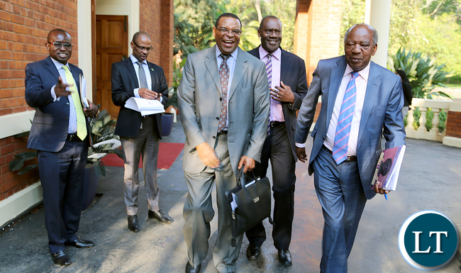 Finance Minister Alexander Chikwanda (R) leaves State House with Bank of Zambia Governor Danny Kalyalya (L), Deputy BOZ Governor Dr. Bwalya Ngandu (behind) and Deputy Finance Minister Christopher Mvunga as Special Assistant to the President (Press and Public Relations) sees them off.