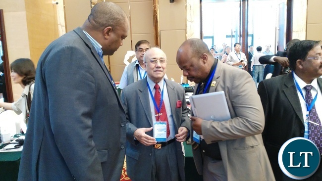 ROAD Transport and Safety Agency (RTSA) director Zindaba Soko (right) and his Deputy for Safety Gladwell Banda (left) listens to International Road Federation (IRF) President Kiran Kapila during the IRF and China Highway and Transportation Society (CHTS) congress and annual meeting in Chongqing, China, recently