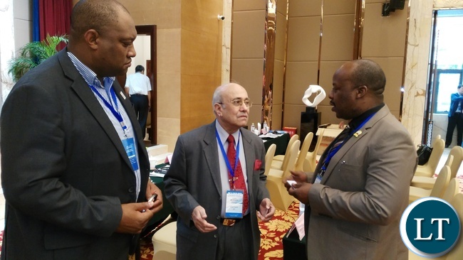 ROAD Transport and Safety Agency (RTSA) director Zindaba Soko (right) and his Deputy for Safety Gladwell Banda (left) listens to International Road Federation (IRF) President Kiran Kapila during the IRF and China Highway and Transportation Society (CHTS) congress and annual meeting in Chongqing, China, recently