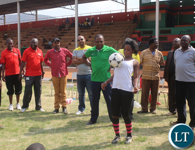 Airtel Talent search hopeful Chadiza Day Secondary G 10 Evelyn Banda showing off her juggling skills while looking on are FAZ President Kalusha Bwalya followed by FAZ Committee member Lee Kawanu and Minister of Youth and Sport Vincent Mwale at Eastern Province Chipata David Kaunda Stadium on Saturday, September 26th.