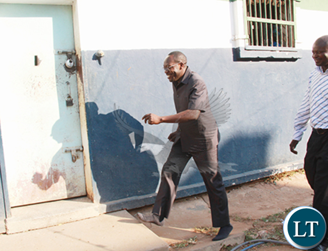 Kaizer Zulu being led into a holding cell