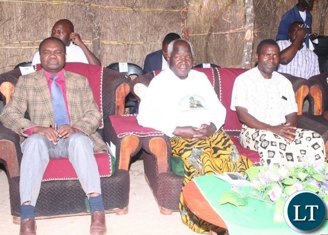 From left to right, North-Western province deputy permanent secretary Alfred Chiingi , Home Affairs deputy minister Lt.Col Panji Kaunda and Kuvuluka Kishakulu tradition ceremony secretary Andrew Mukumata follow the proceedings of the ceremony at chief Matebo’s grounds in Solwezi