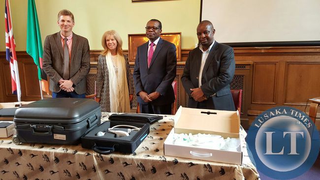 Presenting Ultrasound to Zambian High Commissioner. From left, Huw Jones, Ros Bird, HE Mr Muyeba Chikonde and Dr Charles Msiska