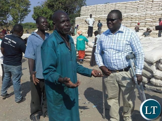 A peasant farmer Chileshe Binwell has delivered 80 bags at the Food Reserve Agency Lwimbo depot in Kasama. Here, Mr Chileshe (left) confers with FRA chief Chola Kafwabulula (right) with whom he shared some of the challanges that include inadequate scales