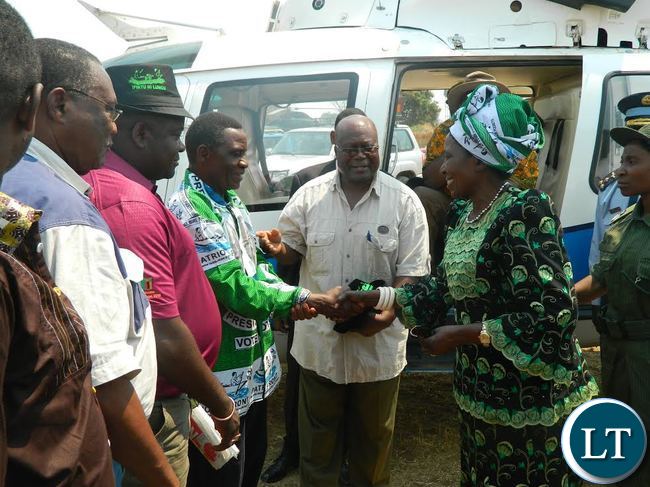 Vice President Inonge Wina greets Patriotic Front candidate George Mwamba for the Lubansenshi parliamentary by-election. In the middle is Northern Province PF chairman, Felix Mfula who introduced Mr. Mwamba to Mrs. Wina when she arrived in Luwingu to campaign for the PF candidate.-PICTURE BY KALUWE HANZUKI/ZANIS