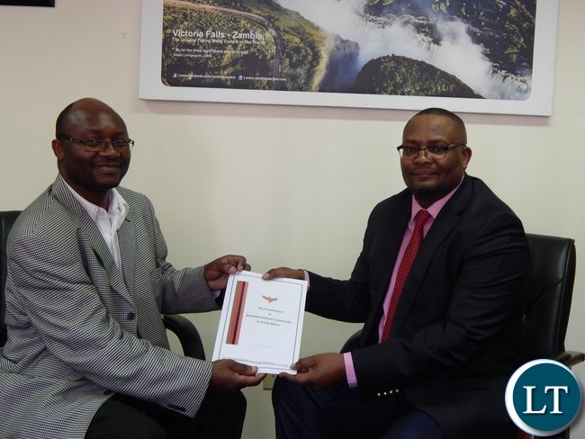 Chairperson of the organisation Mr. Chimwemwe Mtonga presenting a copy of their constitution to the High Commissioner.