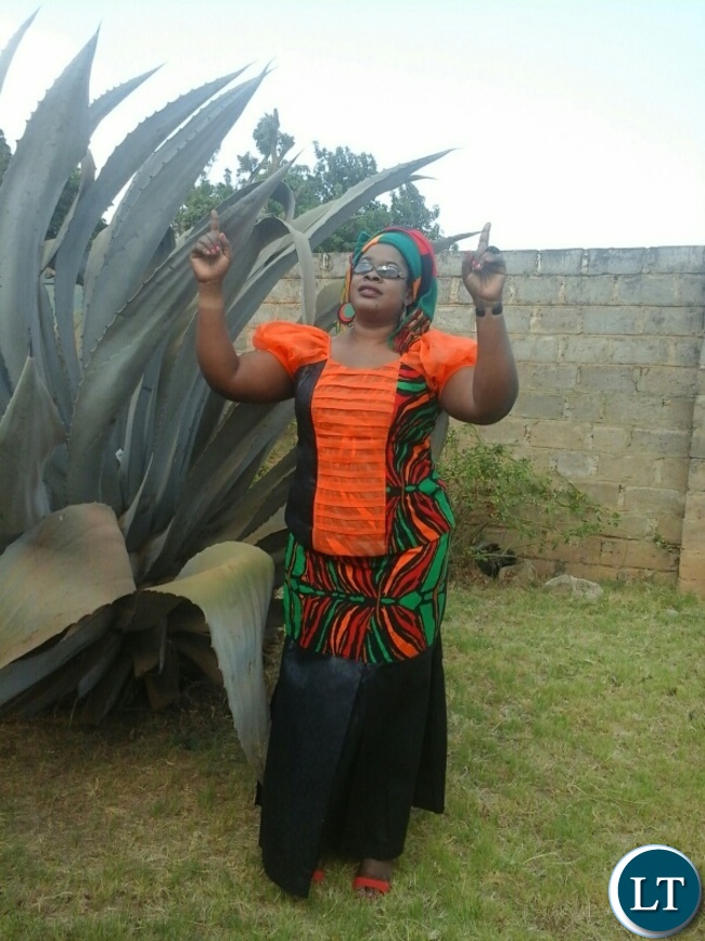 A kabwe woman Mrs Alinat Adorah Phiri clad Zambian flag colours declaring her readiness to join the nation in prayer and fasting
