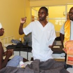 Lewanika General Hospital Eye DepartmentOpthalmic Nurse NamushiWamulume (c) explains to Lions Club of Mongu 3rd President Lion KapaluMuswala (r)during the donation of food stuffs to eye patients to observe the World sight Week ahead of the World Sight Day