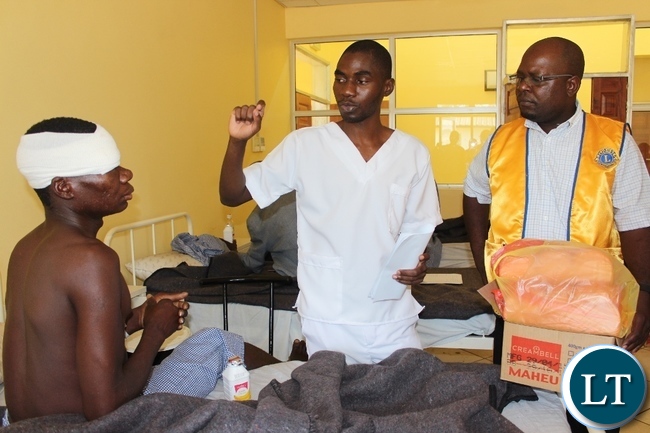 Lewanika General Hospital Eye DepartmentOpthalmic Nurse NamushiWamulume (c) explains to Lions Club of Mongu 3rd President Lion KapaluMuswala (r)during the donation of food stuffs to eye patients to observe the World sight Week ahead of the World Sight Day Lewanika General Hospital Eye DepartmentOpthalmic Nurse NamushiWamulume (c) explains to Lions Club of Mongu 3rd President Lion KapaluMuswala (r)during the donation of food stuffs to eye patients to observe the World sight Week ahead of the World Sight Day