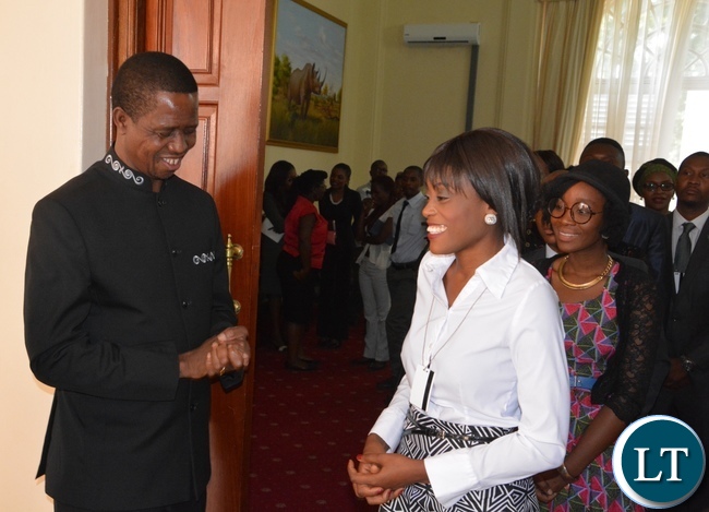President Edgar Lungu chats with Kawambwa District Magistrate Nandipha Ngulube at State House during the meeting with Mandela Washington Fellowship of young African Leaders