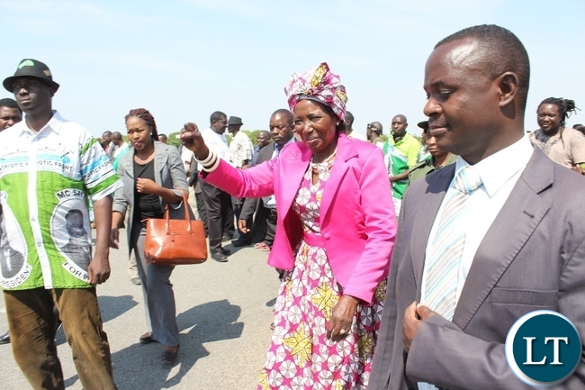 Vice President Inonge Wina (c) on arrival at Mongu Airport to officiate at the Inonge Wina Independence Football Championship Tournament in her constituency in Nalolo District