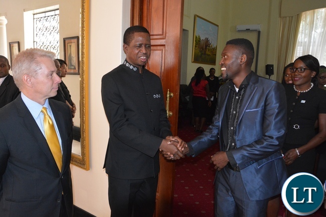 President Edgar Lungu chats with Brian Bwambya (Bflow) whilst USA Ambassador Eric Schultz at State House looks on during the meeting with Mandela Washington Fellowship of young African Leaders