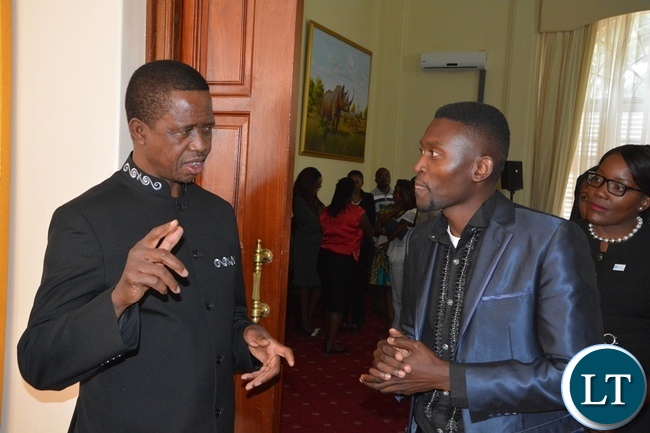 President Edgar Lungu chats with Brian Bwembya at State House during the meeting with Mandela Washington Fellowship of young African Leaders