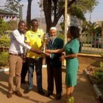 L-R:Provincial Acting Youth Coordinator Trywell Moonga, Eastern Province Permanent Secretary Chanda Kasolo, National Sport Council of Zambia Board Member Haroon Ghumra and provincial sports coordinator Rhoda Goma holding an independence trophy donated to Eastern Province by sport council in Chipata