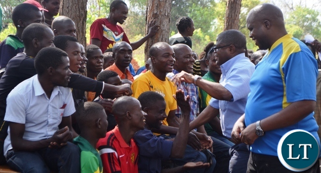 MALOLE MP Christopher Yaluma accompanied by Simon Mwila greets residents at Rosa Mission.Picture by KENNEDY MUPESENI