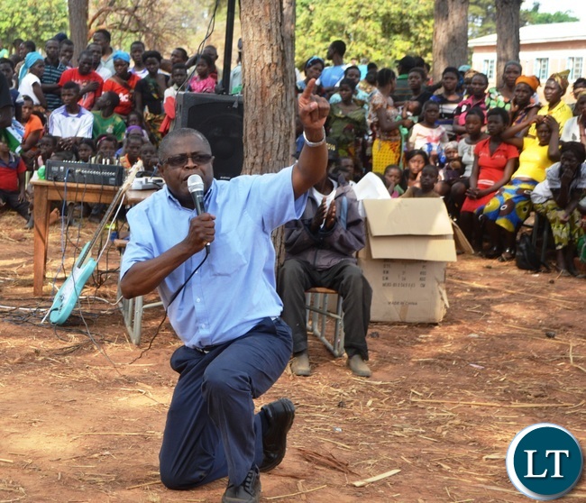 MALOLE MP Christopher Yaluma kneels to thank residents at Rosa Mission for massively voting for President Edgar Lungu .Picture by KENNEDY MUPESENI (1)