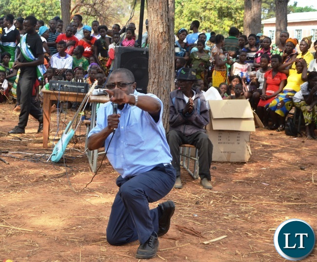 MALOLE MP Christopher Yaluma kneels to thank residents at Rosa Mission for massively voting for President Edgar Lungu .Picture by KENNEDY MUPESENI (3)