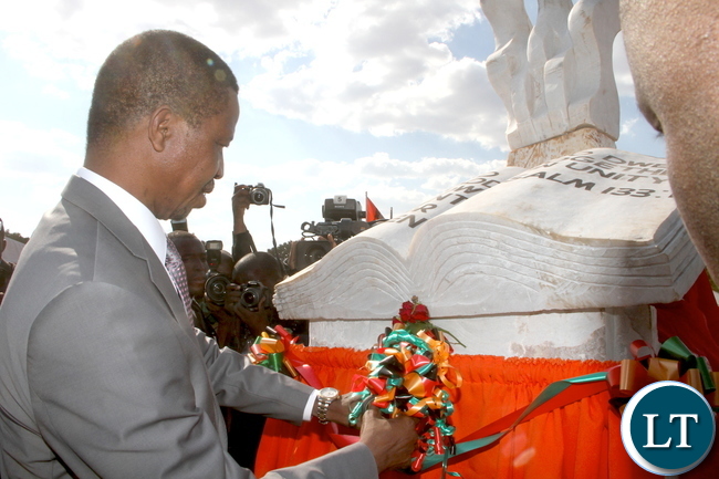 President Lungu cuts a ribbon during the Ground breaking ceremony for the New Cathedral and Interdenominational Thanks Giving Church Service at woodlands reserve forest area in Lusaka on Sunday, October 25,2015 -Pictures by THOMAS NSAMA