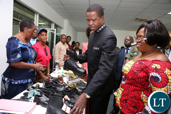 President Edgar Lungu talks to Gladys Mpungu and Matildah Kasonde of Rainbow Sovew shoes of Luansya during the exhibition at Mulungushi confrence Centre for the National Women Economic Empowerment Expo, which was Promoting Young Women enterpreneurs as a Change agents for National development . Picture By Eddie Mwanaleza/ Statehouse. 13-10-2015.
