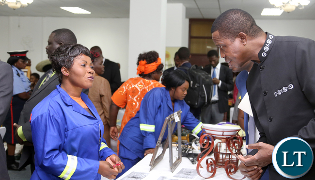 President Edgar Lungu talks to Grace Chibwe a Contractor of Chadiza during the exhibition at Mulungushi confrence Centre for the National Women Economic Empowerment Expo, which was Promoting Young Women enterpreneurs as a Change agents for National development . Picture By Eddie Mwanaleza/ Statehouse. 13-10-2015.