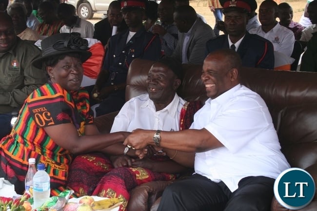 Higher education minister Dr Michael Kaingu (r) shares a light moment with former health minister and also former member of the central committee Allina Nyikosa (l) during the 51st Zambia ‘s Independence celebrations at Solwezi stadium in Solwezi on Saturday as North-Western province freedom fighters chairman Bwanga Wisamba (m ) looks on Higher education minister Dr Michael Kaingu (r) shares a light moment with former health minister and also former member of the central committee Allina Nyikosa (l) during the 51st Zambia ‘s Independence celebrations at Solwezi stadium in Solwezi on Saturday as North-Western province freedom fighters chairman Bwanga Wisamba (m ) looks on
