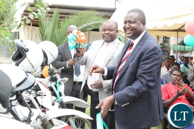 Deputy Minister of Youth and Sports, Ronald Chitotela(m) Zambia Country representative for UNICEF,Hamid El –Bashir Ibrahim at the handover ceremony of motor Bikes by United Nations Children’ Fund(UNICEF) to the Ministry of Youth and Sports in Lusaka t