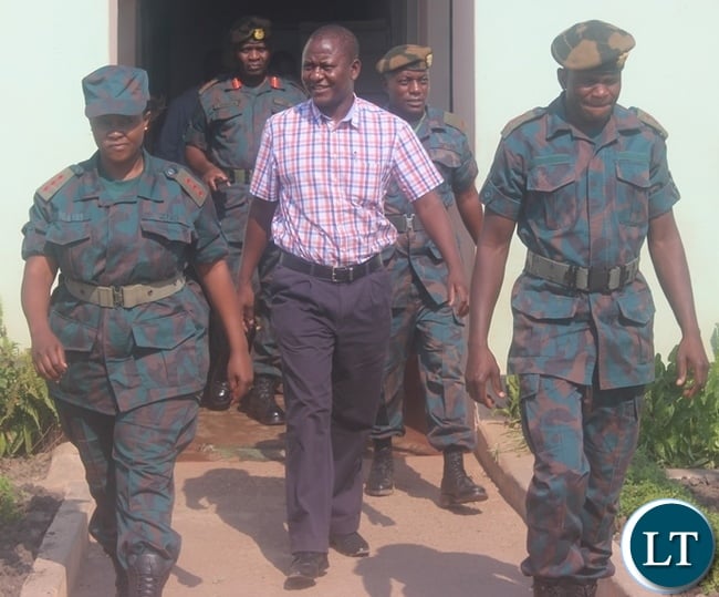 Central Province Minister Davies Chisopa (in civil ) inspecting the newly acquired equipment to be working on the roads in Central province