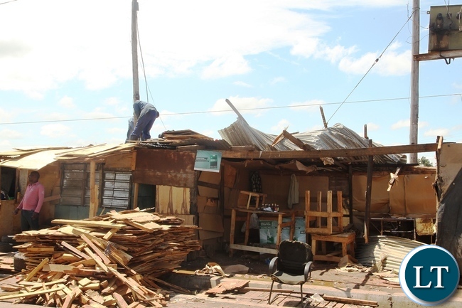 Baulini Resident renovete the roof after it was blown off due to heavy rains in Baulini