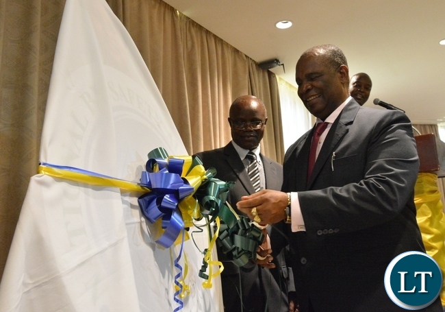 Higher Education Minister Micheal Kaingu unveils the logo of the National Biosafety Authority to officially launch the National Biosafety Authority