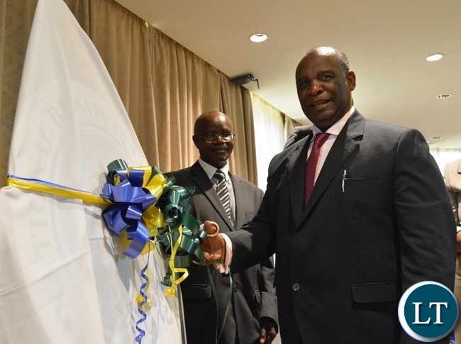 Higher Education Minister Micheal Kaingu unveils the logo of the National Biosafety Authority to officially launch the National Biosafety Authority